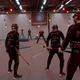 Actors in motion capture suits performing moves that would later be animated into the game.